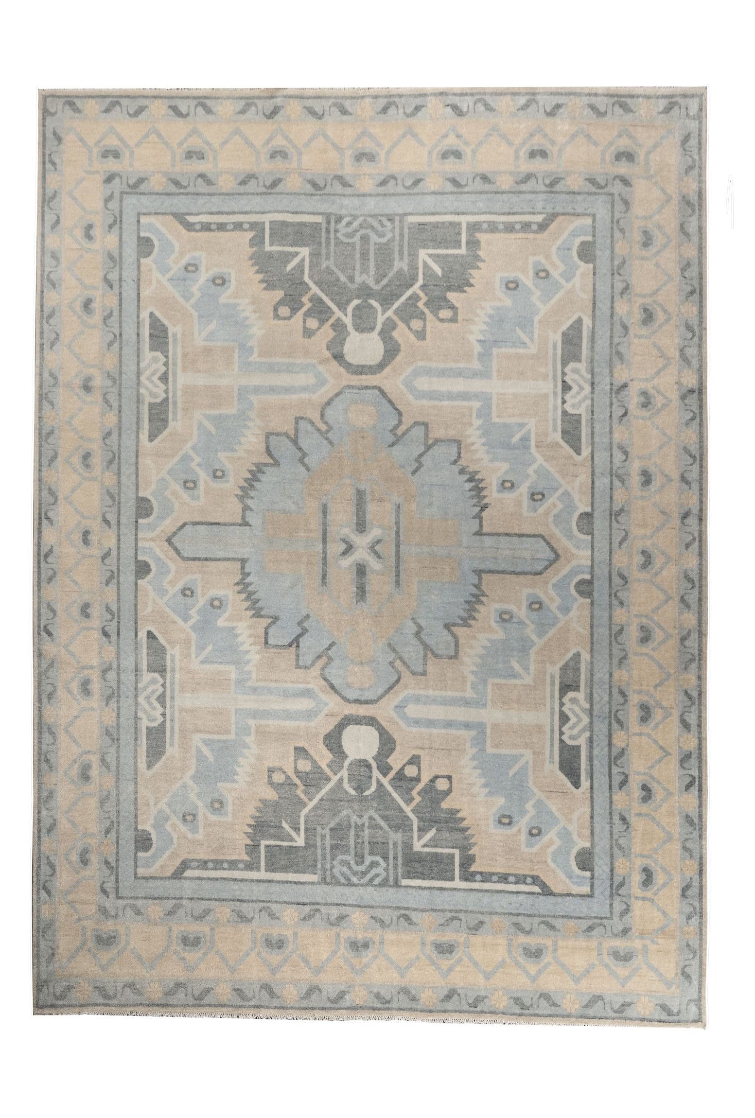 Neutral toned and hand-knotted Oushak style rug made of 100% New Zealand wool. This rug is comprised of blue, light blue, ivory, beige, charcoal, and gray colors.