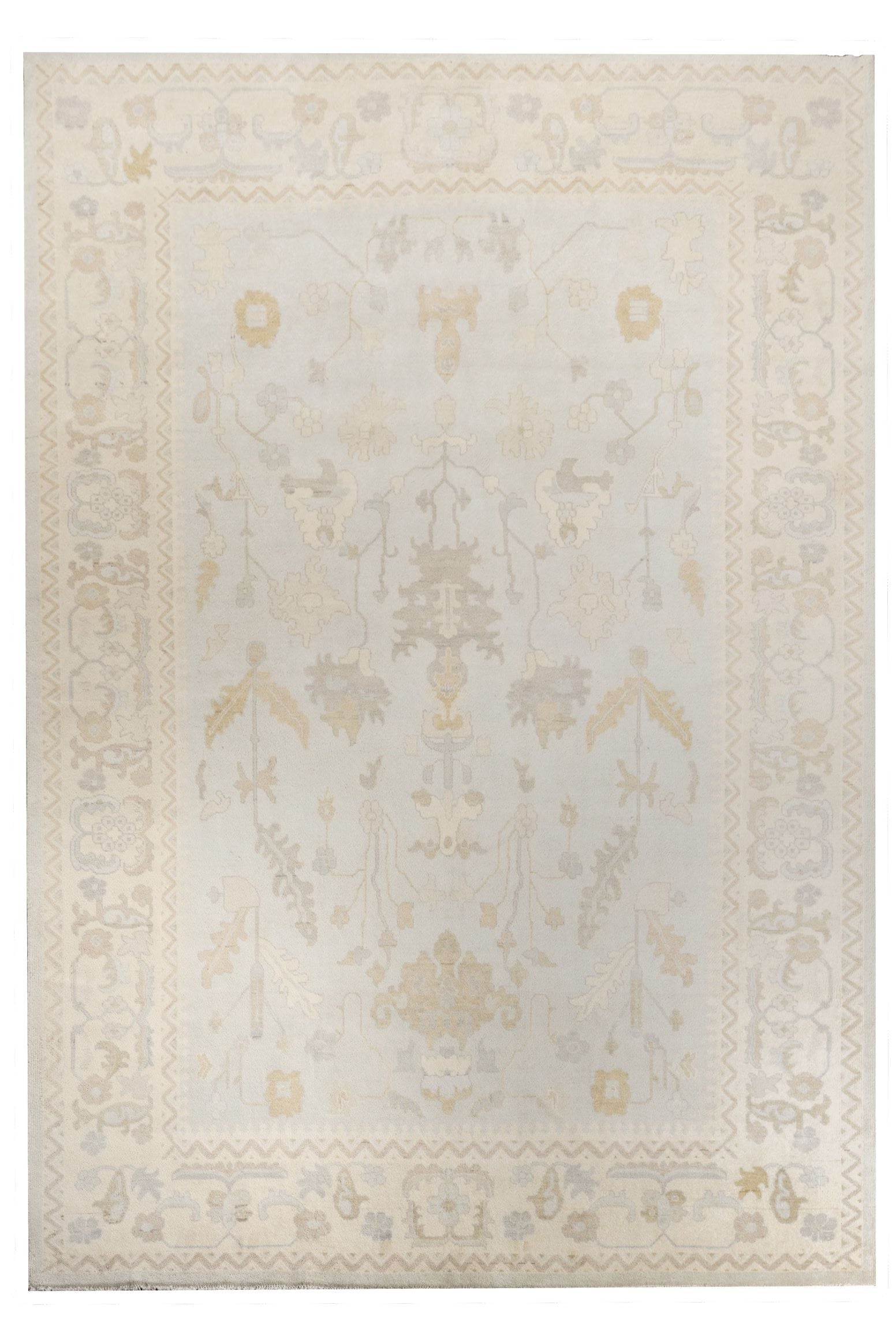 Neutral toned and hand-knotted Oushak style rug made of 100% New Zealand wool. This rug is comprised of tan, beige, brown, gray, and blue colors.