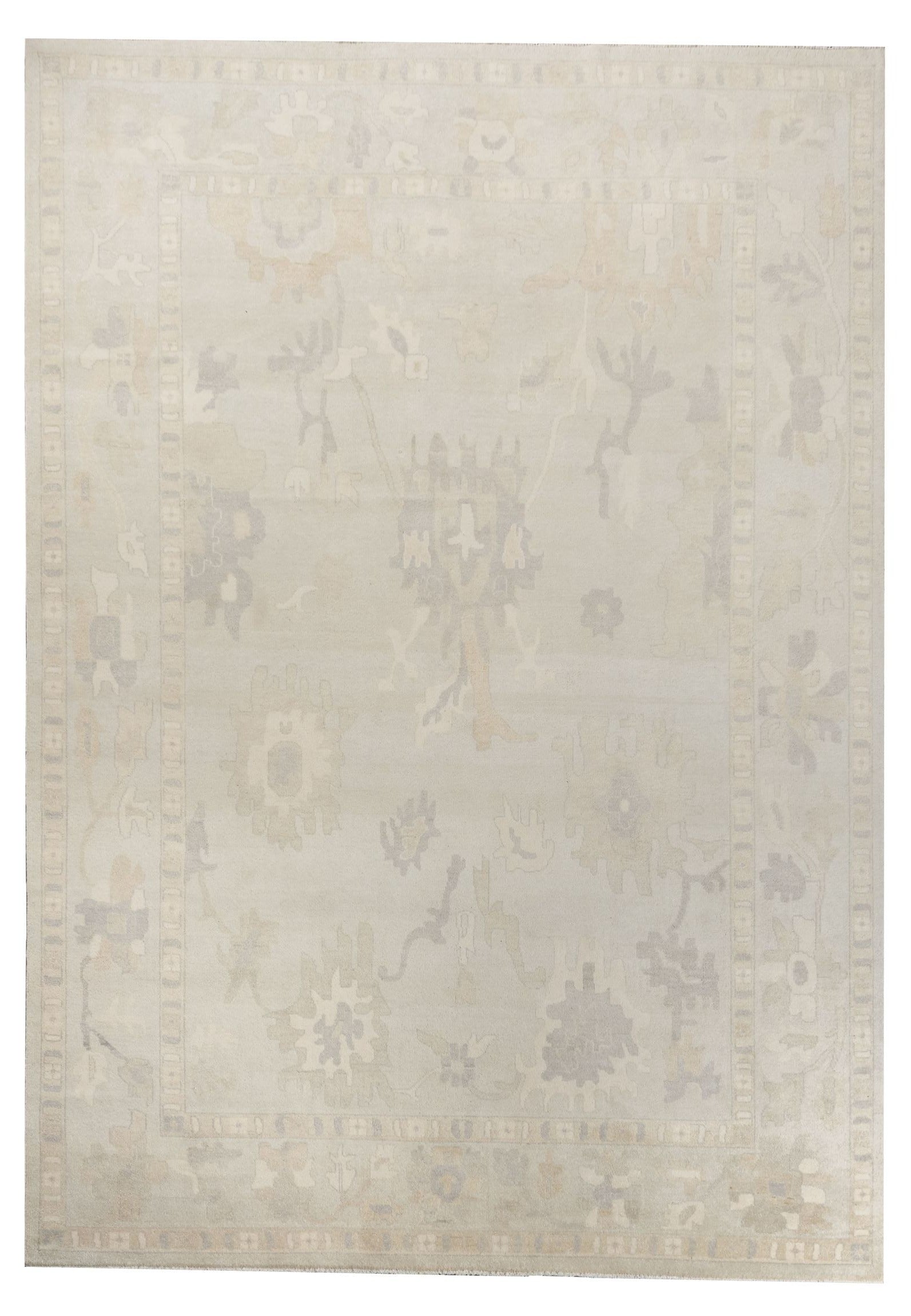 Neutral toned and hand-knotted Oushak style rug made of 100% New Zealand wool. This rug is comprised of ivory, gray and beige colors. 