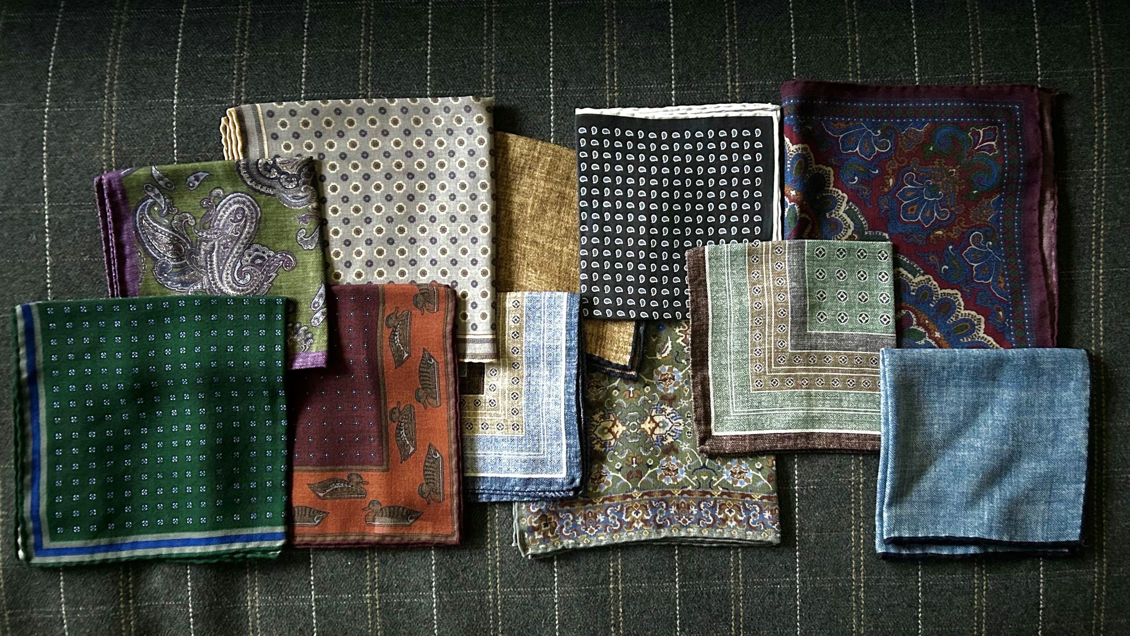 a lot of different folded, patterned, and colored cloths