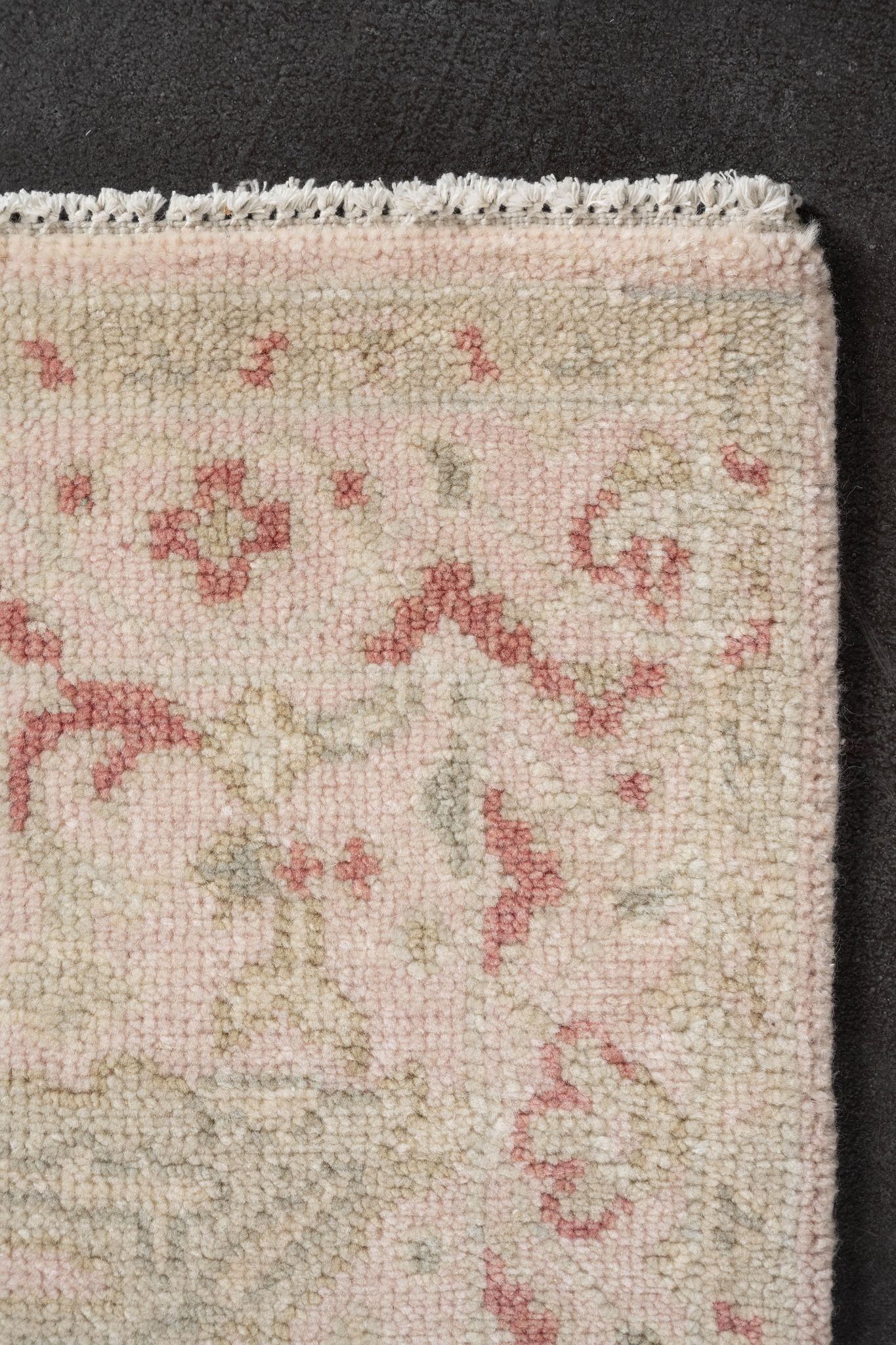 Neutral toned and hand-knotted Oushak style rug made of 100% New Zealand wool. This rug is comprised of pink, beige, tan, salmon, coral, blush, blue, ivory colors.