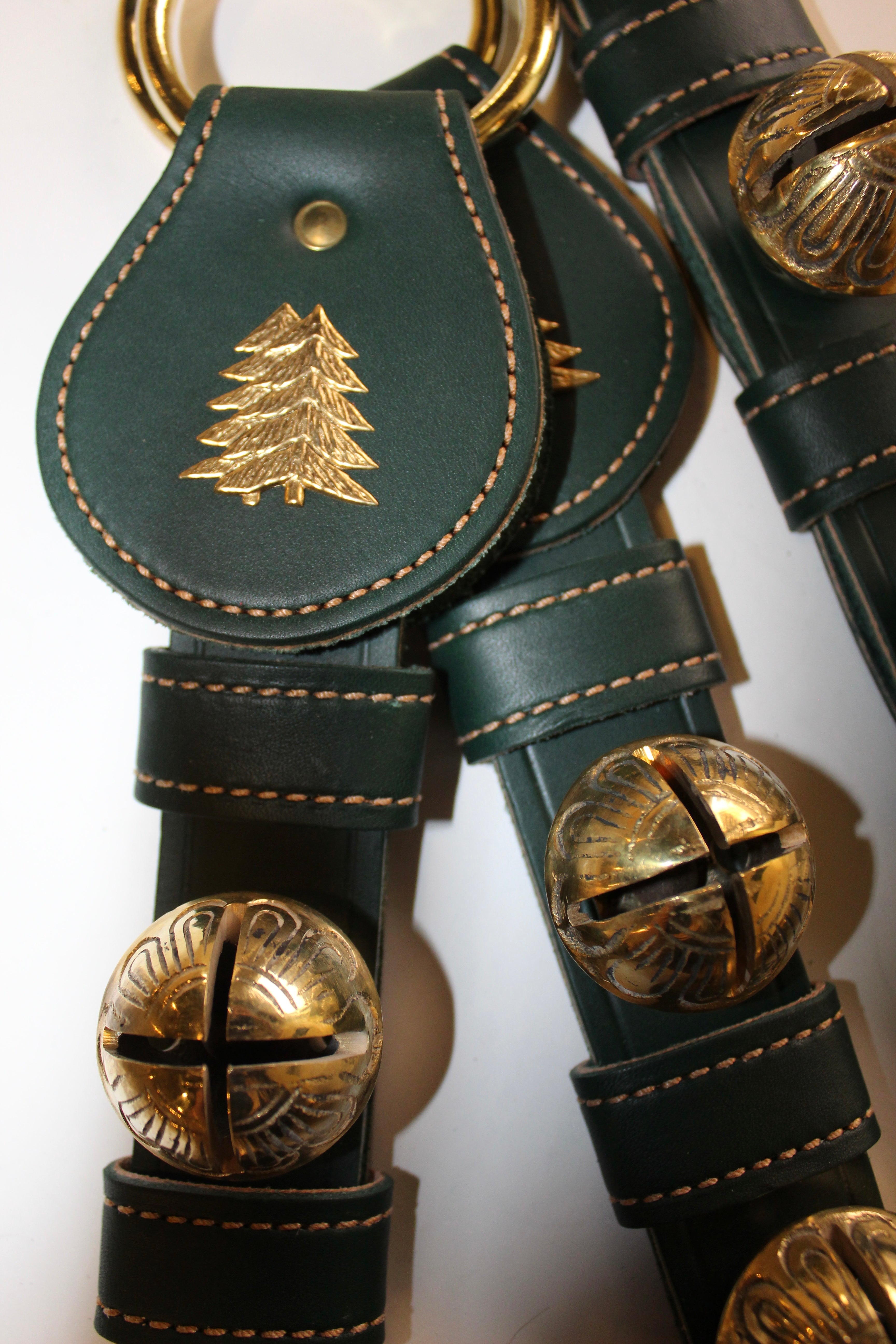 Green and brass Christmas bell door hanger