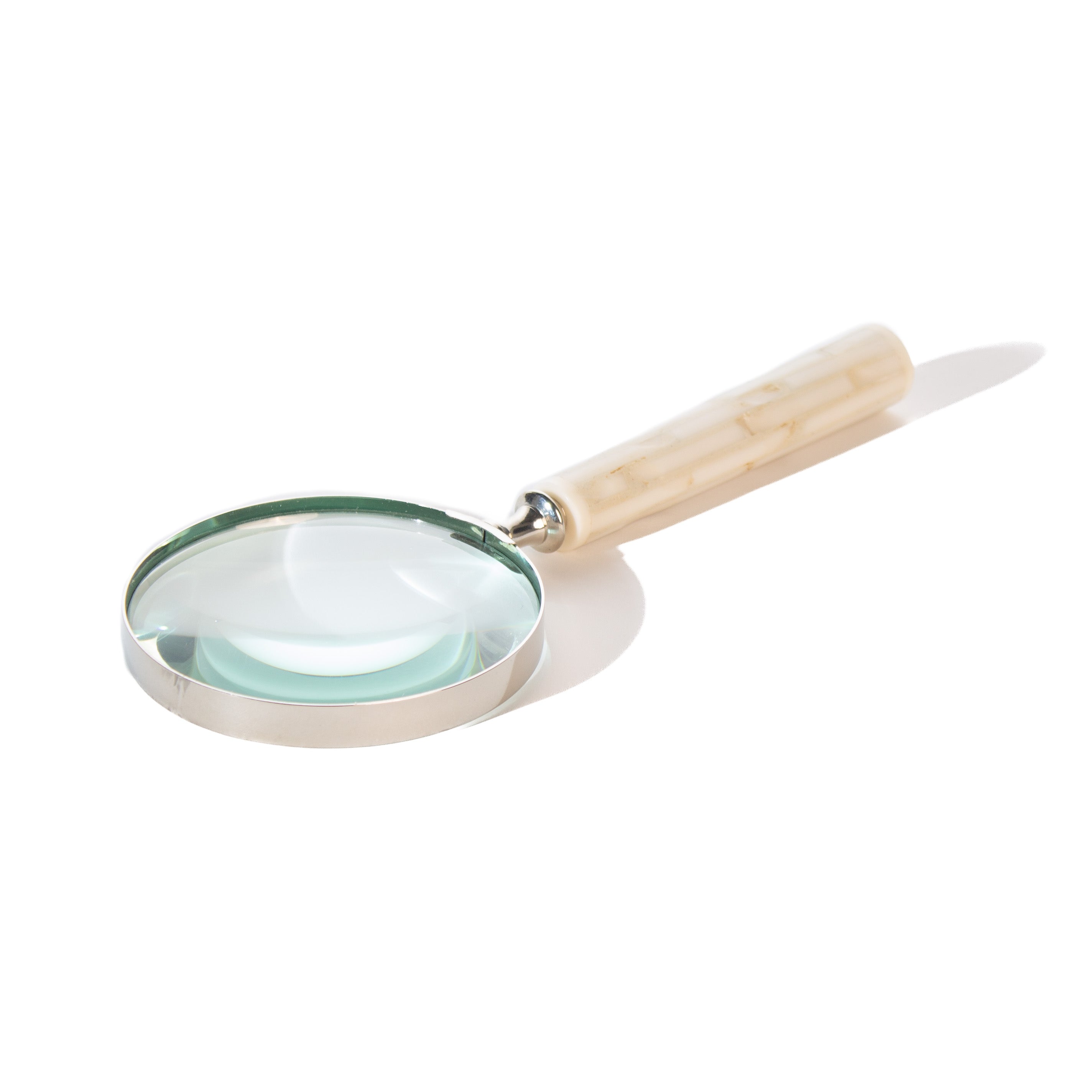 Decorative magnifying glass.  Bone handle shaped like bamboo with silver-rimmed magnifier.  