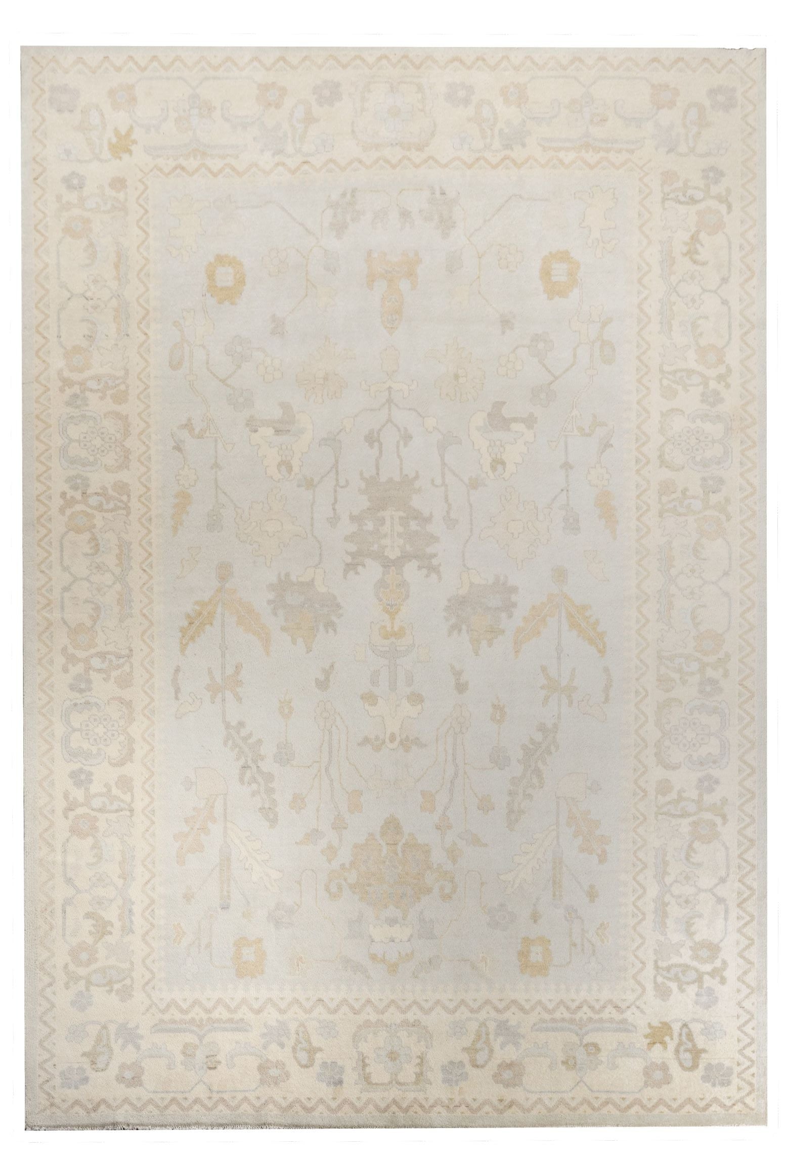 Neutral toned and hand-knotted Oushak style rug made of 100% New Zealand wool. This rug is comprised of tan, beige, brown, gray, and blue colors. 